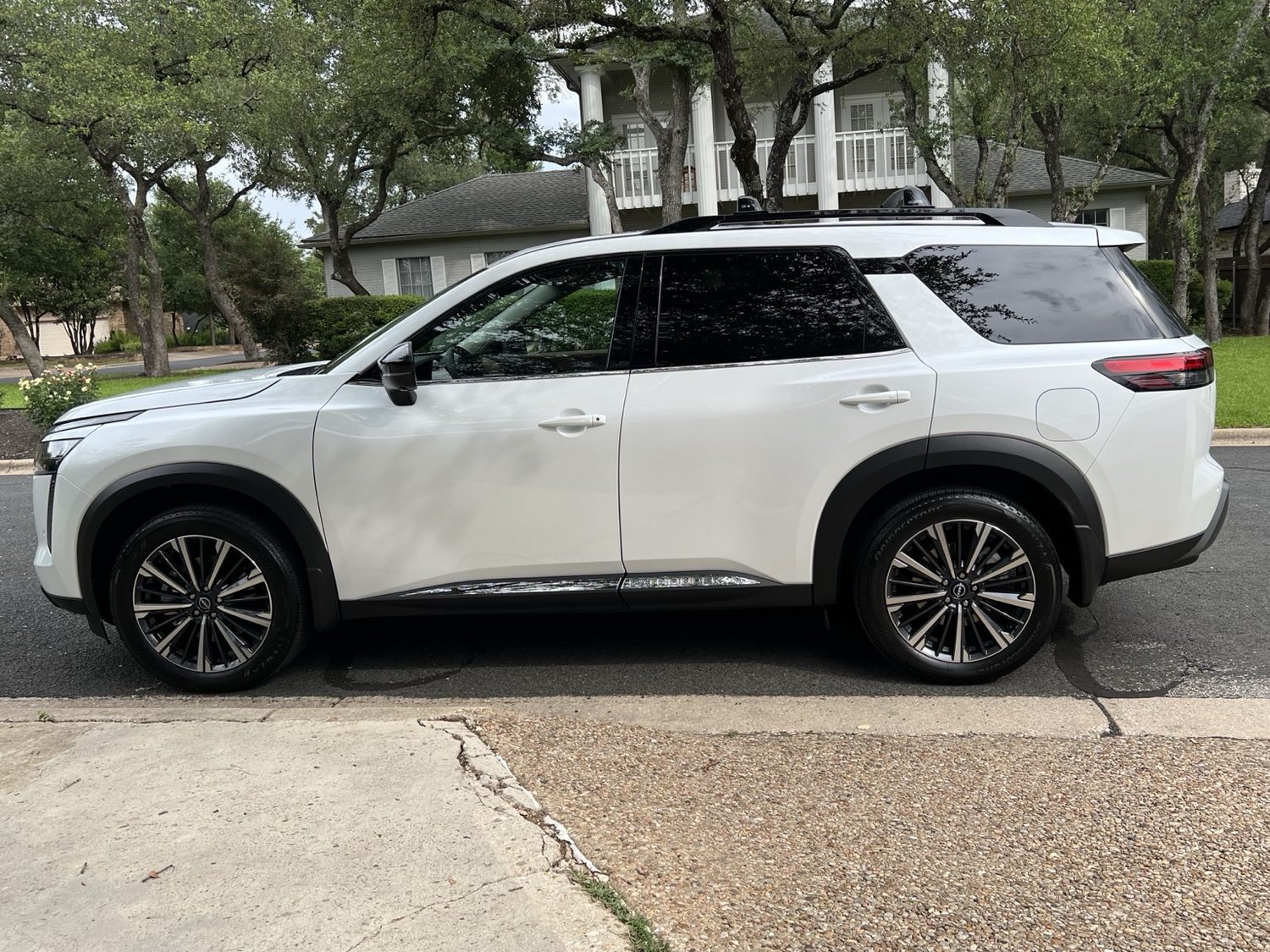 White 2026 Nissan Pathfinder Platinum parked outside