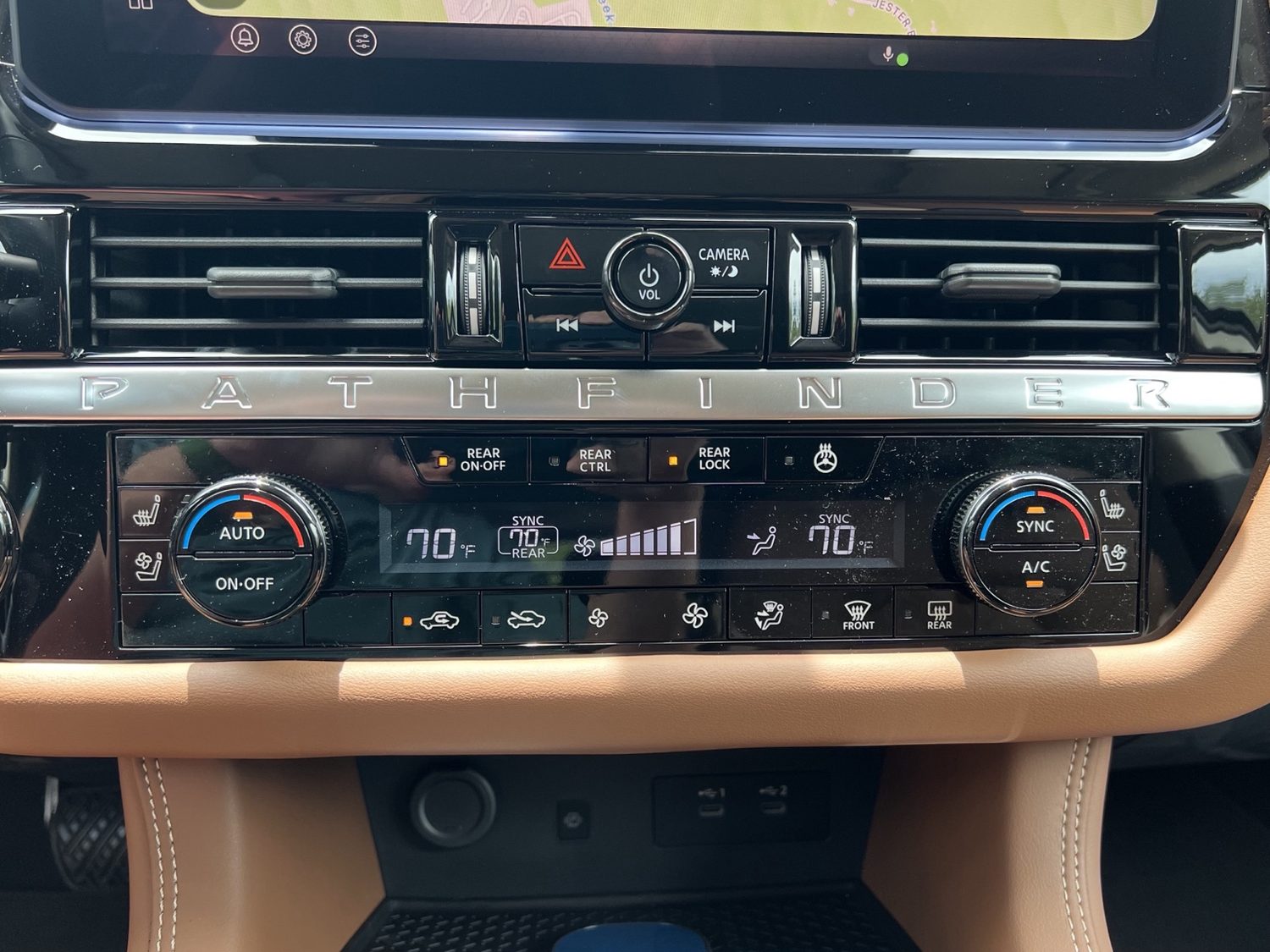 Front climate panel with heated and ventilated seats, AUTO, rear controls, defrost, fan, and airflow