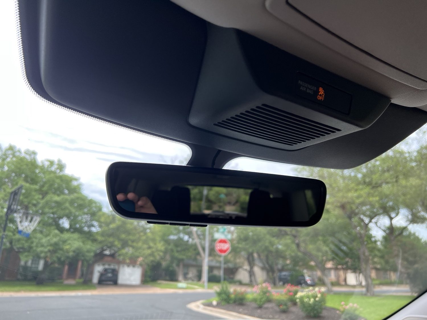 Rearview mirror, sensor area, and passenger airbag indicator