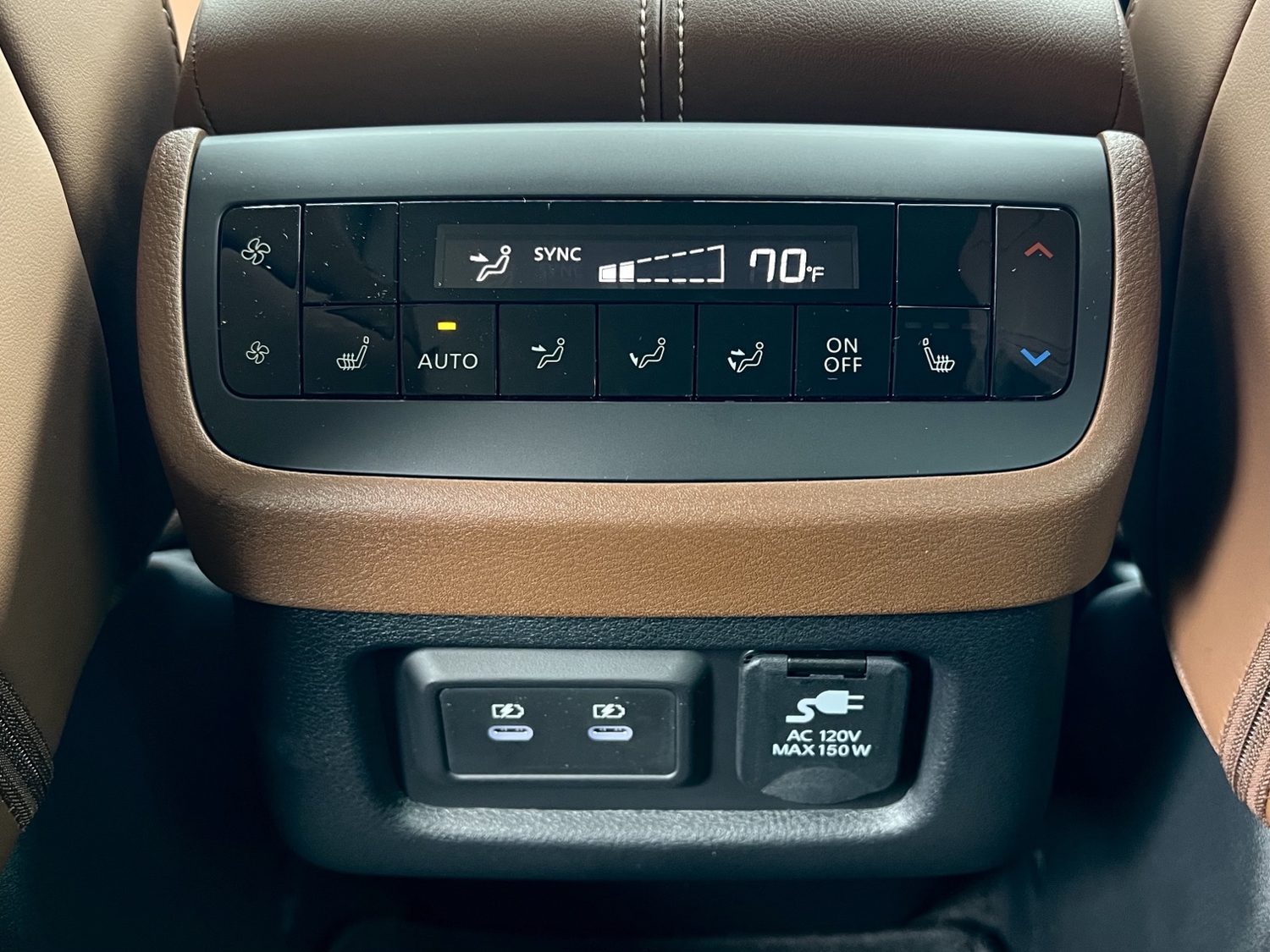 Second-row climate panel with heated seat buttons, USB-C ports, and 120V outlet