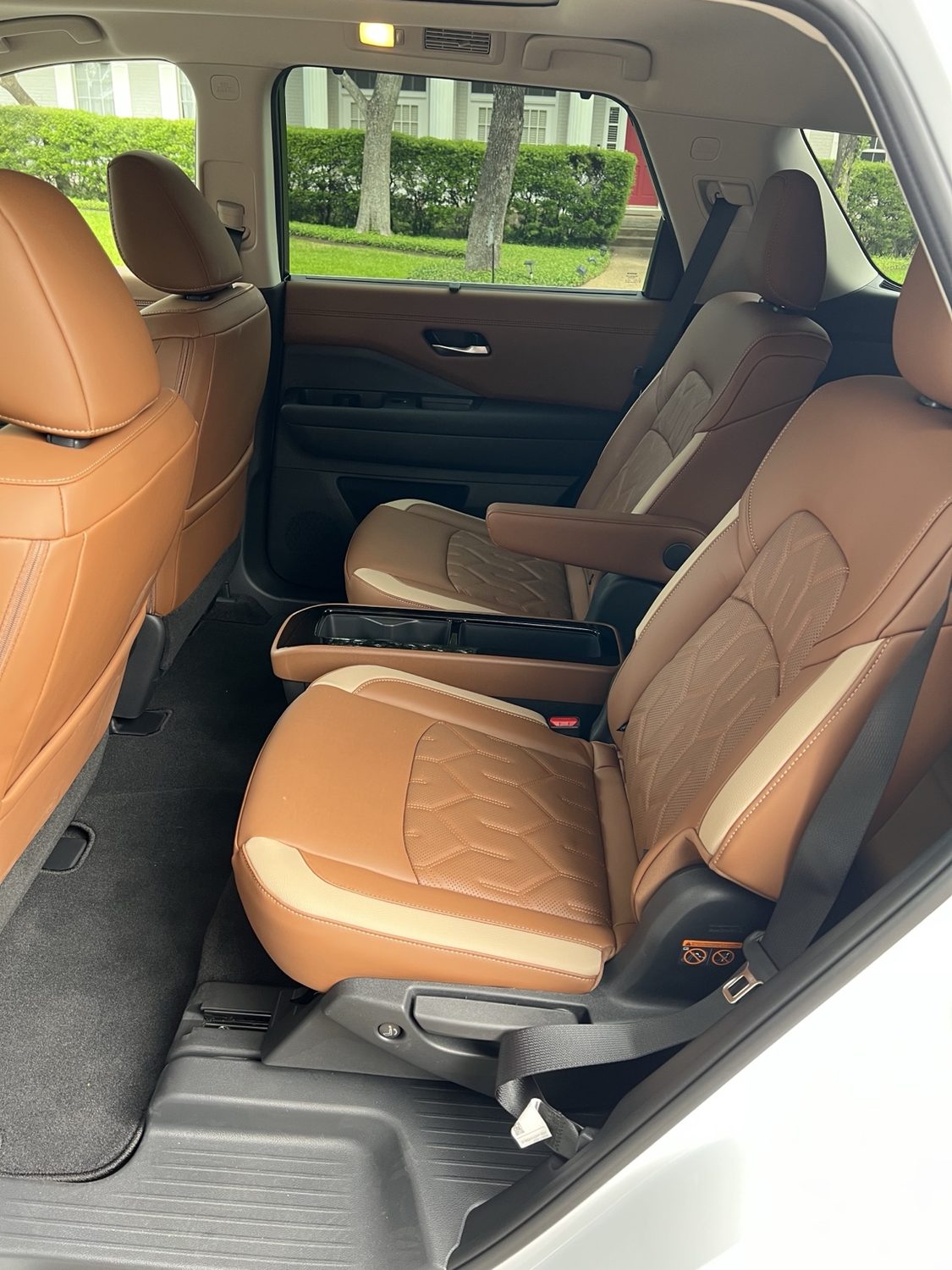 Second-row captain's chairs with armrests and center console