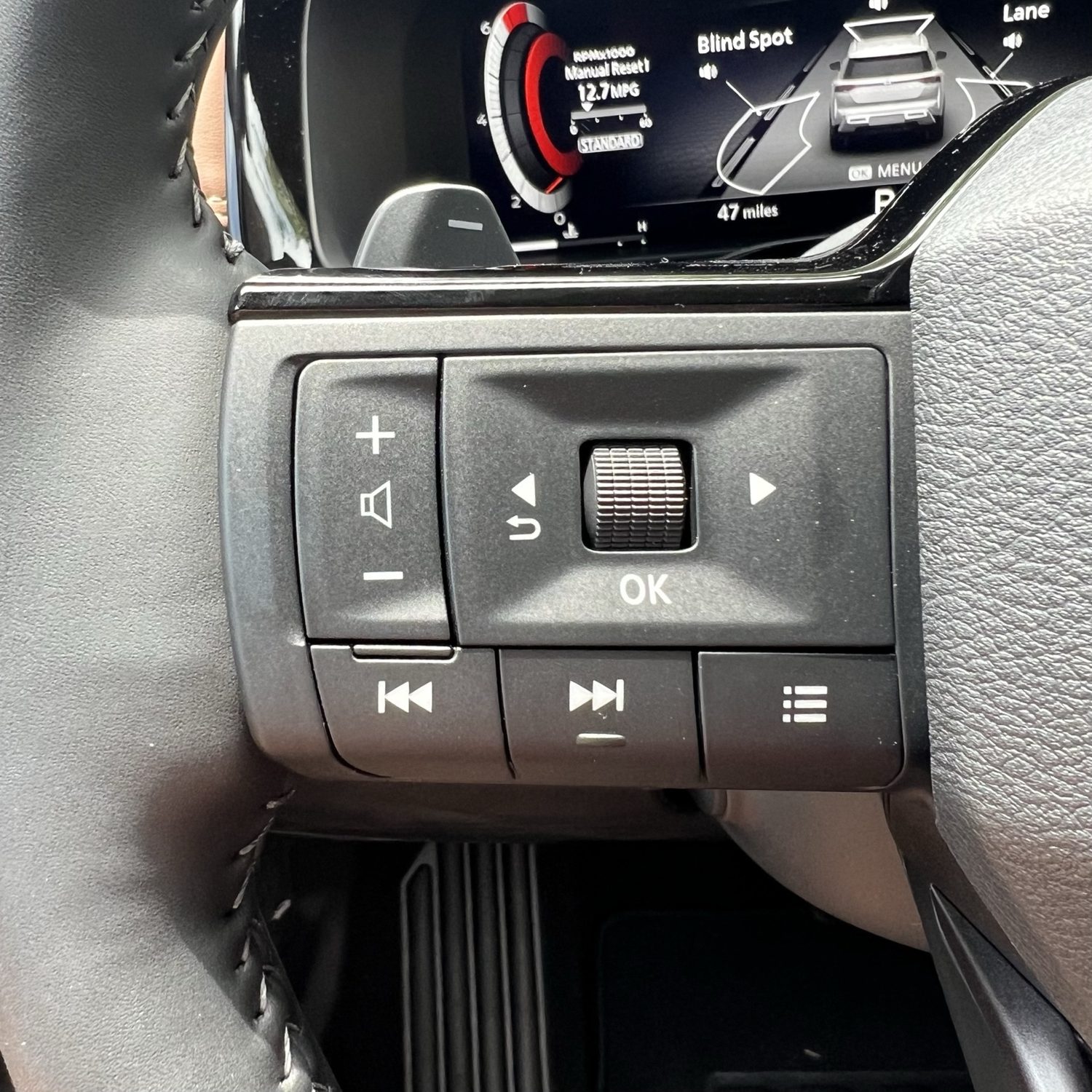 Left steering wheel controls for audio and driver display